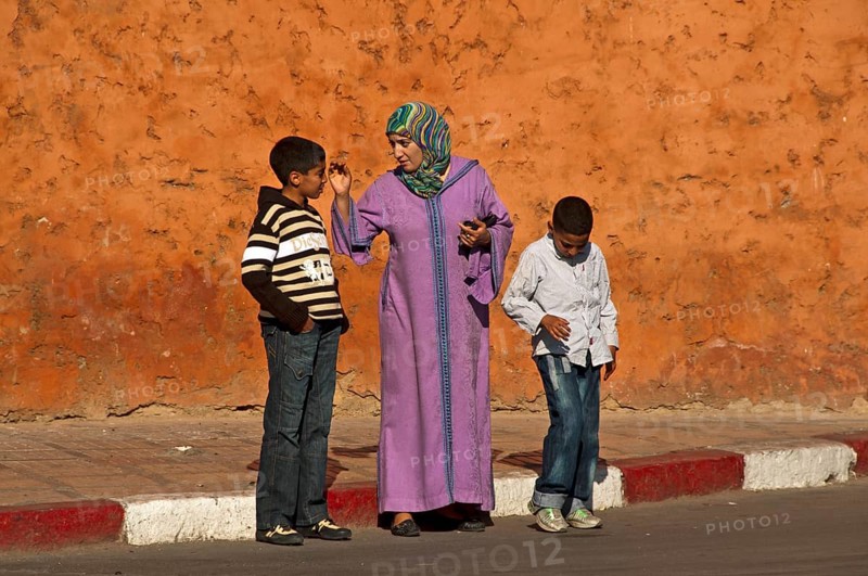 Mother in traditional dress with djellaba and headscarf