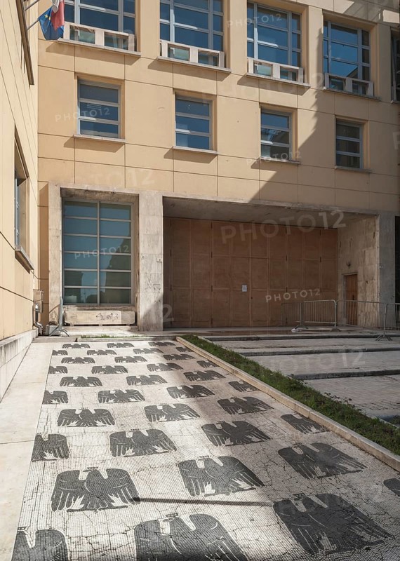 Entrance to a school with a marble mosaic