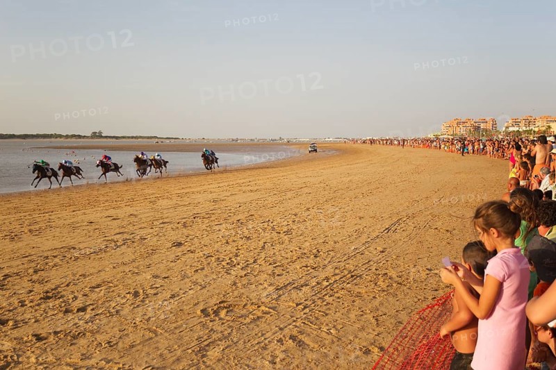 Horse race at the beach of Sanlucar de Barrameda at the Guadalquivir river mouth