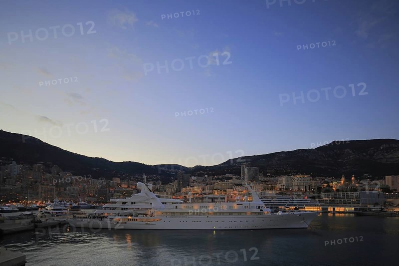 Motor yacht Atlantis II in the evening in Port Hercule