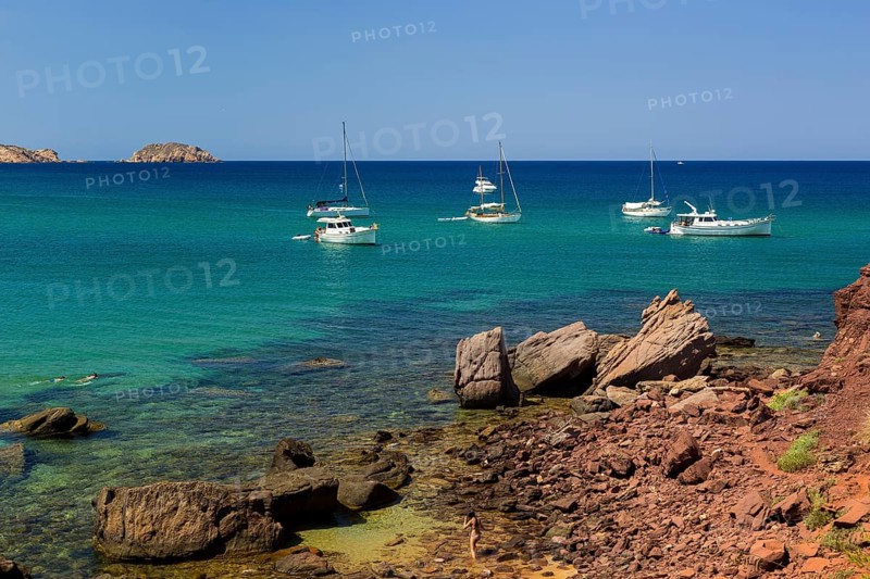 Sailing boats off the coast