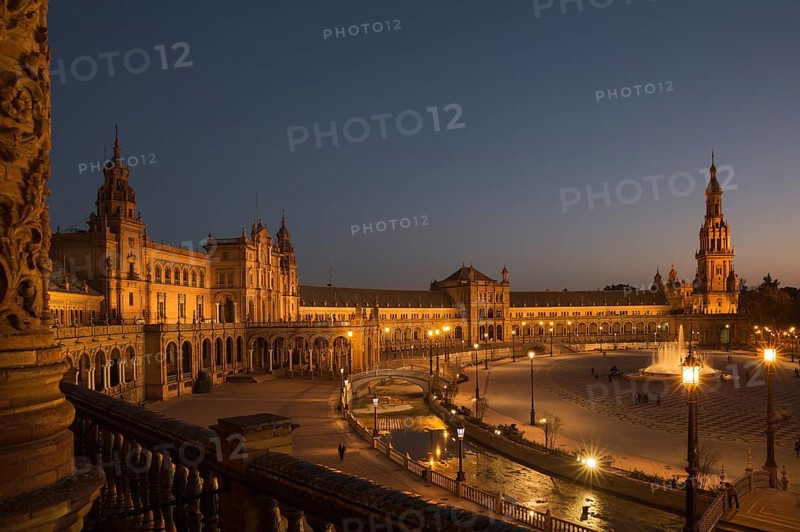 The illuminated Plaza de Espana at dusk