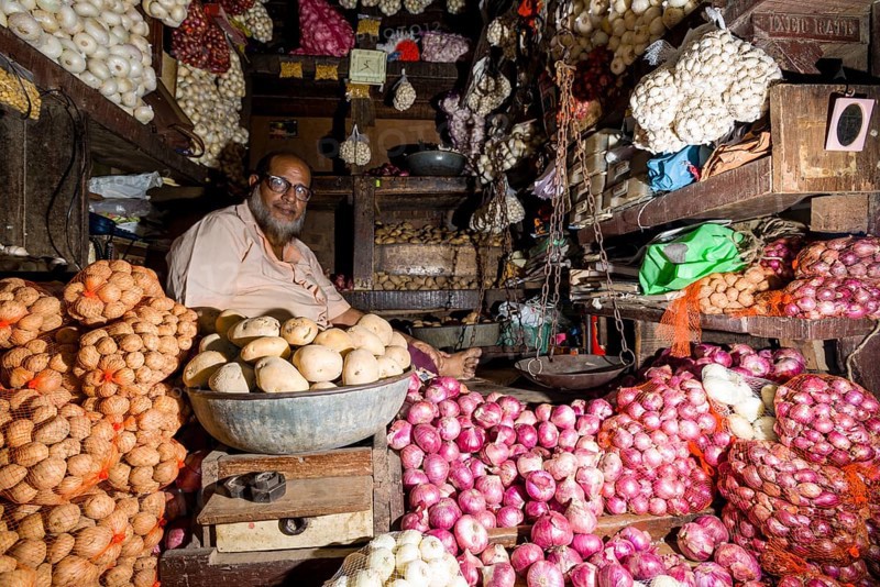 Man selling potatoes and onions at Crawfort Market