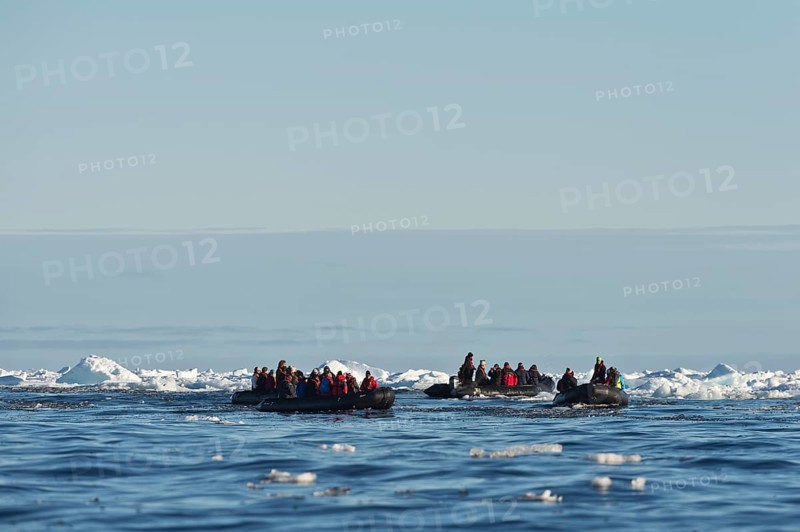 Tourists in inflatable boats