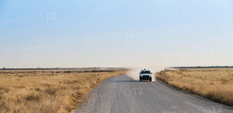 Car travelling on a dirt road