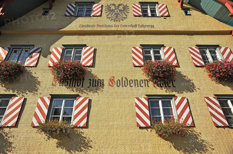 Shingle facade with windows and flower boxes