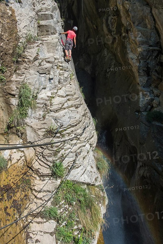 Female climber on the fixed rope route 'Via Farinetta'