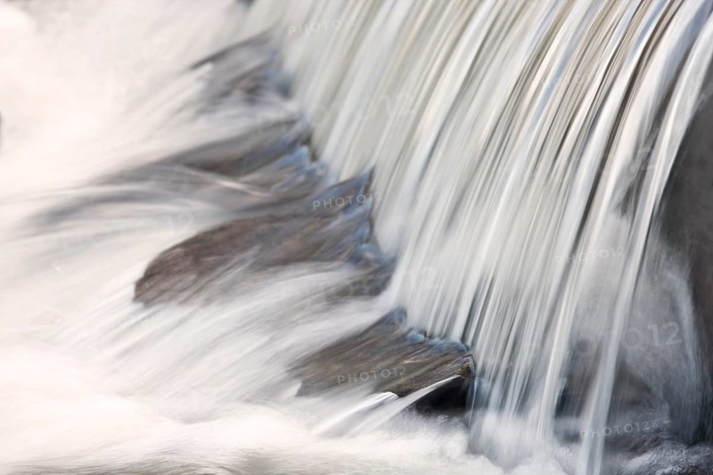Mountain stream with small waterfall