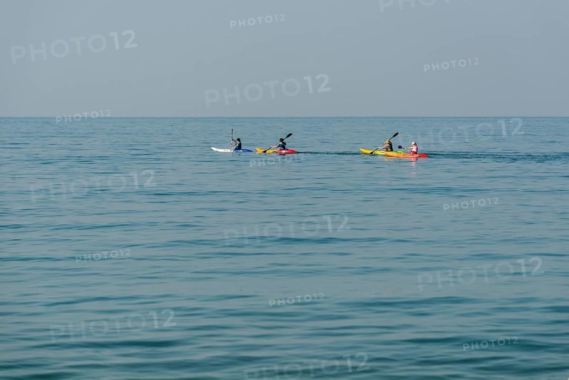 Kayakers in the open sea