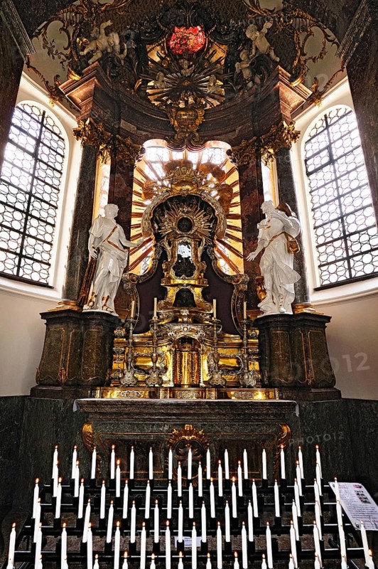 Side altar with votive candles