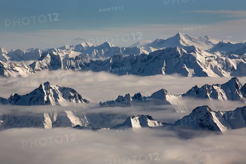 The peaks of the Zillertal Alps rising above the sea of fog