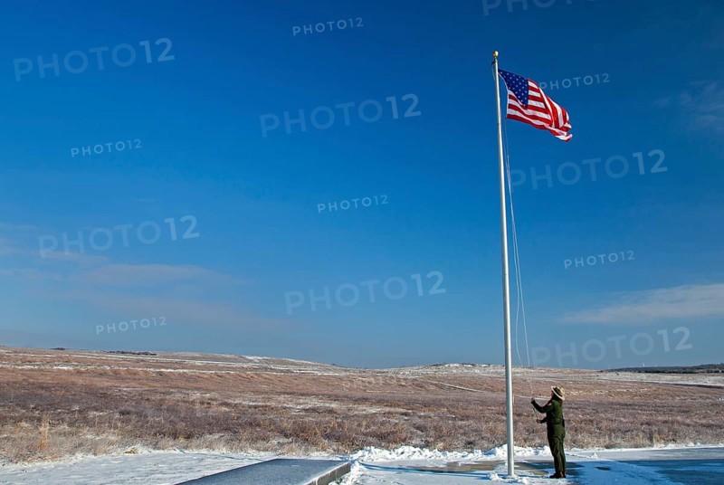 A park ranger raises the flag at the The Flight 93 National Memorial