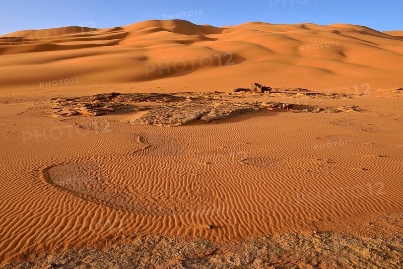 Sand dunes and sandstone rocks at Oued In Djerane
