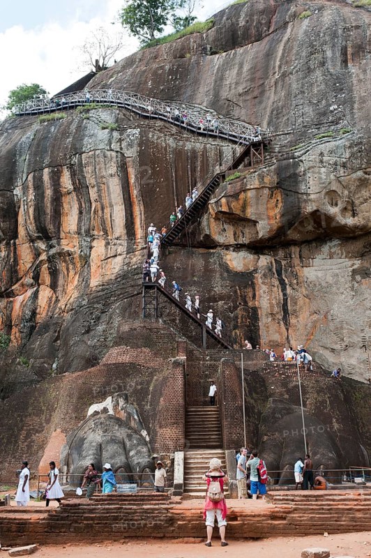 Visitors climbing the steep stairs to the rock fortress of Sigiriya