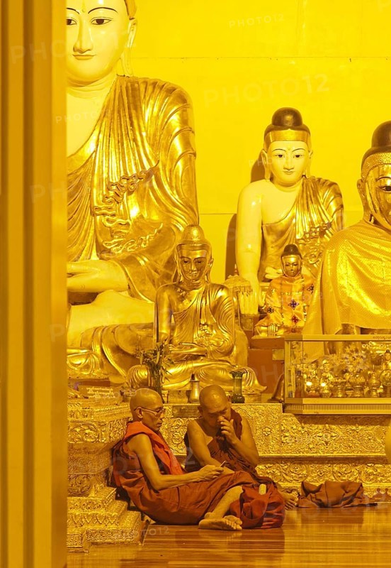 Two Buddhist monks with a mobile phone