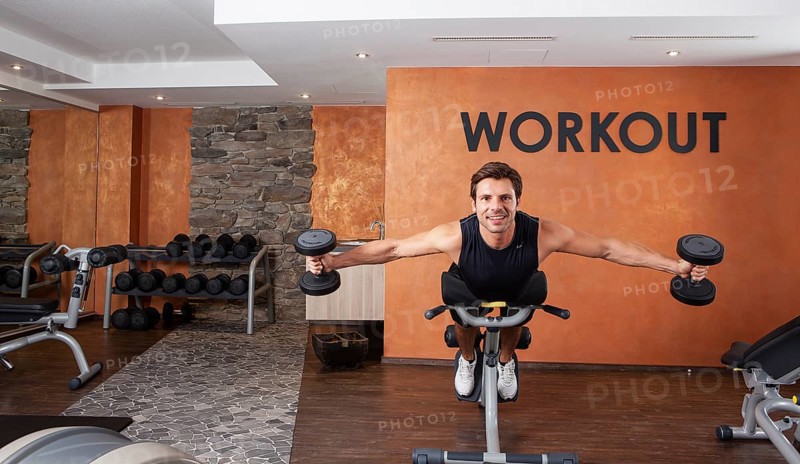 Man doing fitness exercises in a gym