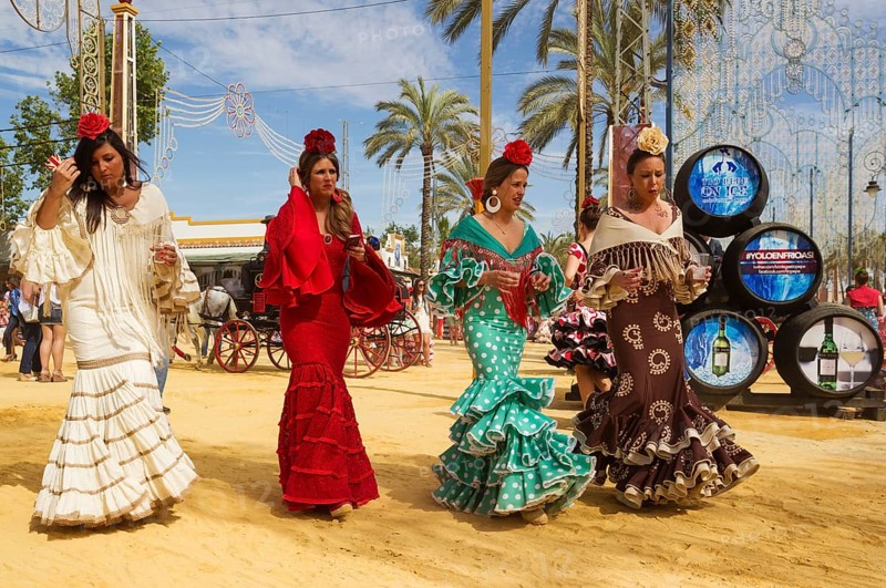 Women wearing gypsy dresses at the Feria del Caballo