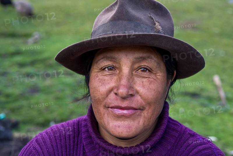 Friendly Quechua Indian woman wearing a hat