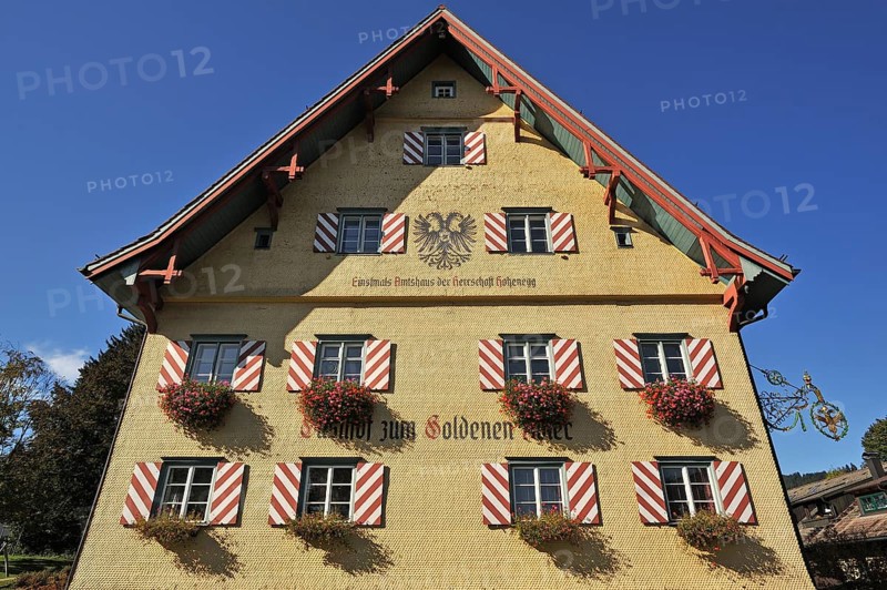 Shingle facade with windows and flower boxes