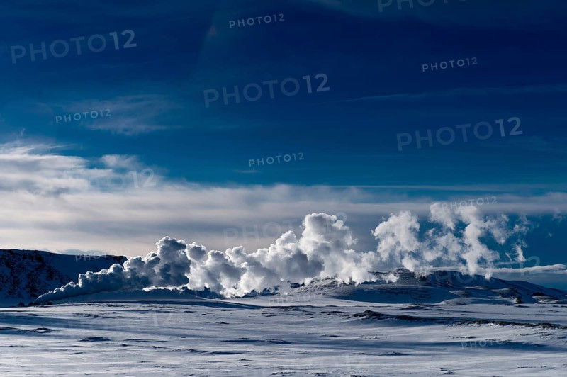 Geyser in a snow-covered landscape