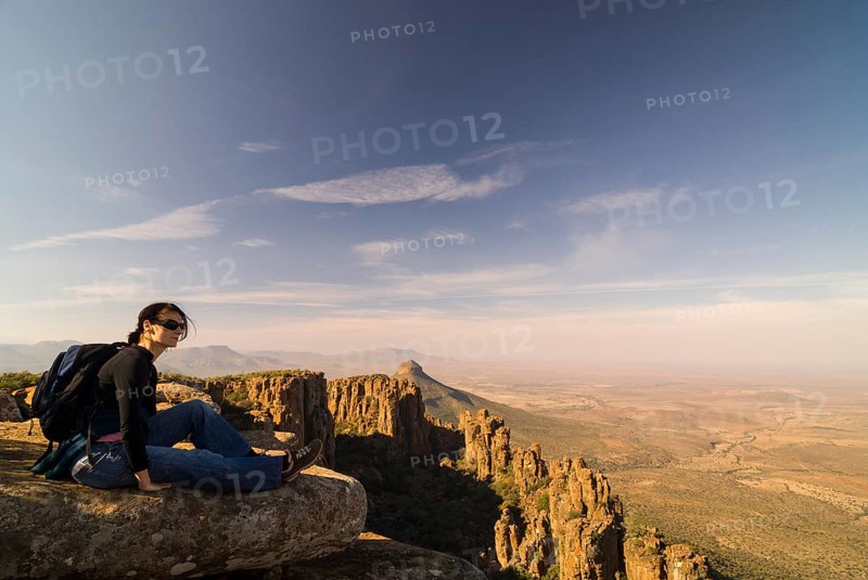 Hiker enjoying the views of the Spandau-Koppe and the Camdeboo Plains