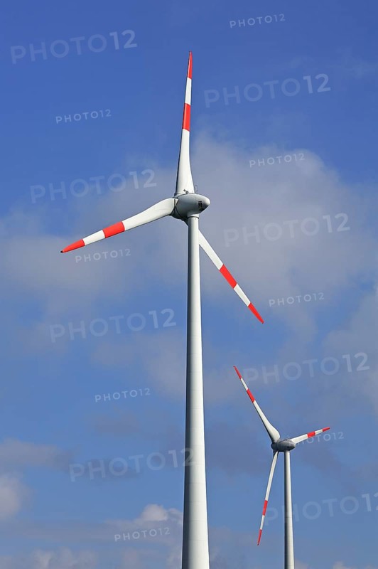 Wind turbines against blue sky