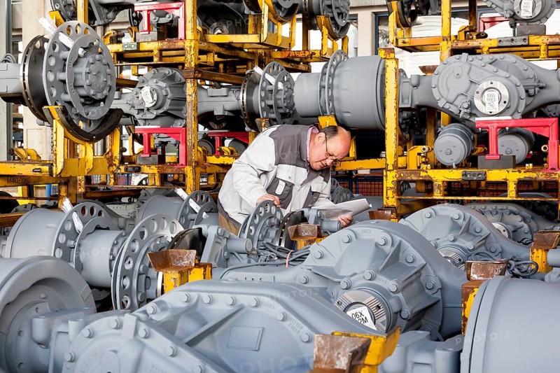 Worker checking truck drive axles from MAN Truck and Bus AG