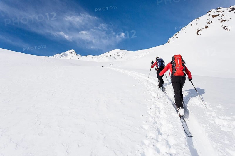 Ski tourers climbing Stotz mountain