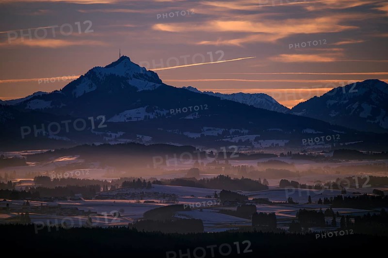 Peak of Mt Grunten with the Alpine foothills at sunset