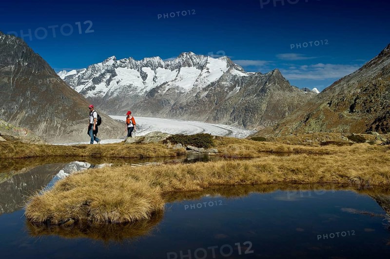 Mountain lake and hikers on Bettmerhorn Mountain