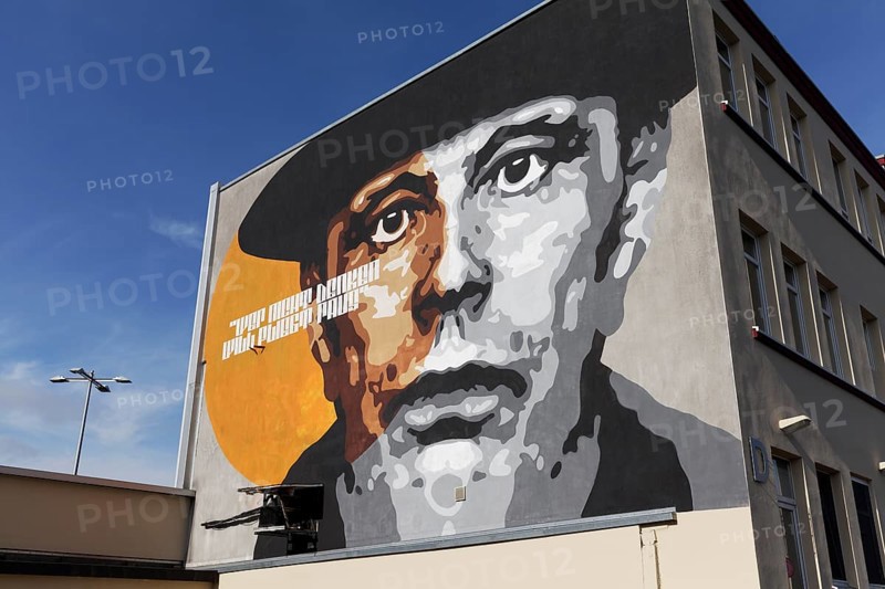 Portrait of the artist Joseph Beuys on a house wall