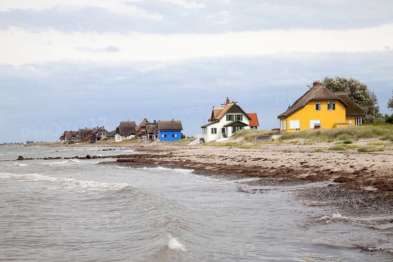 Cottages with thatched roofs on the coast