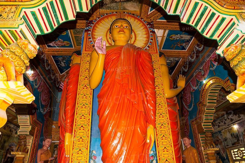 Statue in the old Buddhist temple complex of Sri Pushparama Maha Viharaya