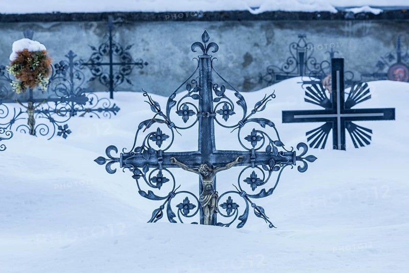 Grave crosses in deep snow