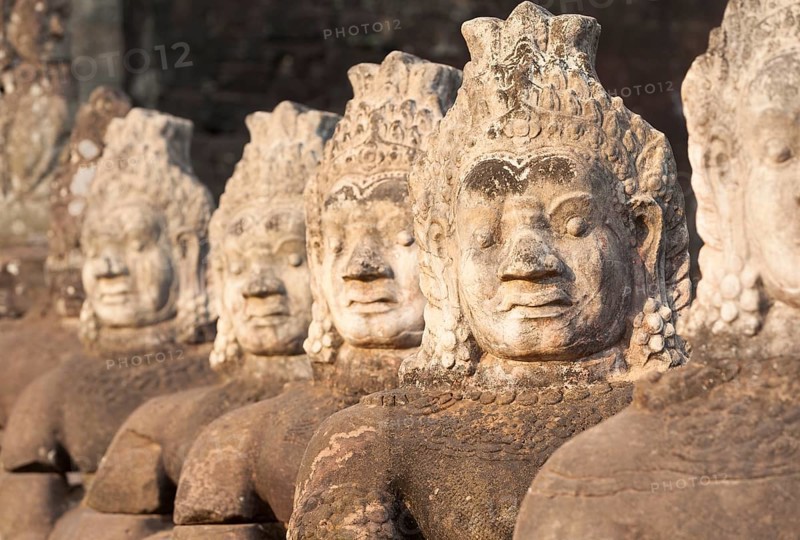 Asura statues aligned at the south gate causeway of Angkor Thom