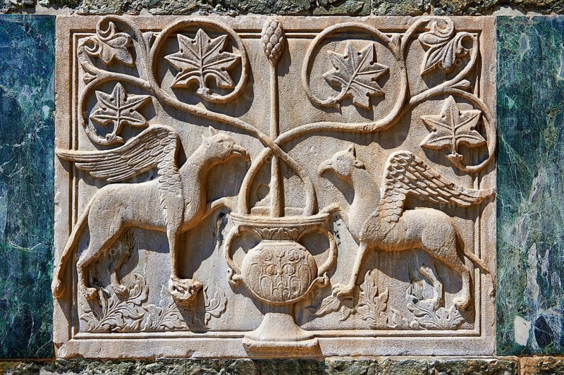 Medieval Oriental Byzantine bas-relief of two winged griffins on the facade of St Mark's Basilica