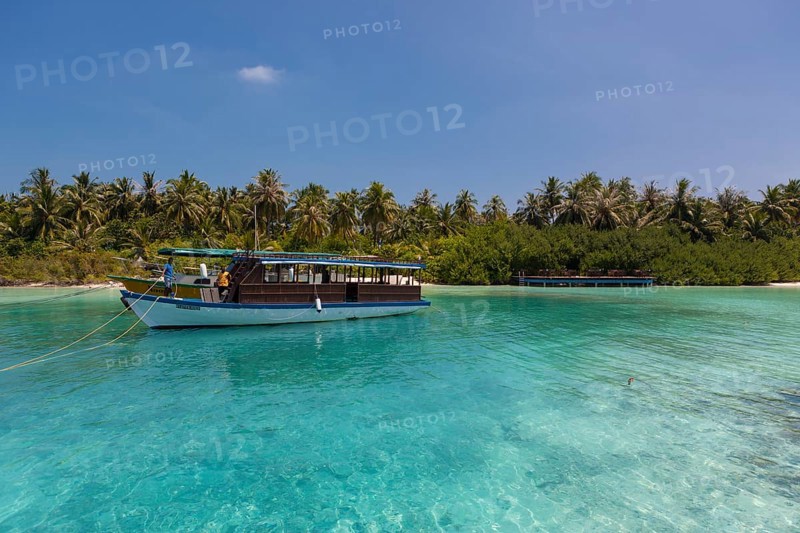Boat in front of a Maldives island