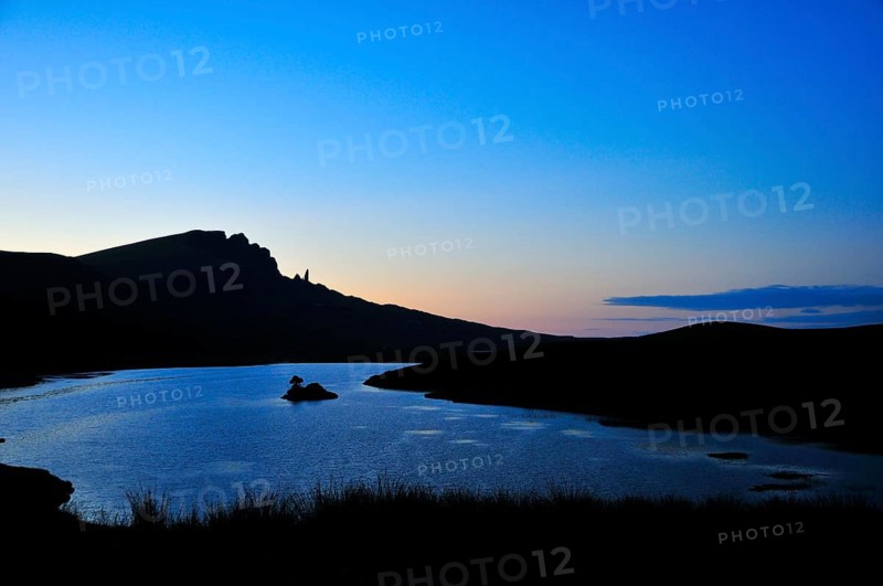 View at dusk across Loch Fada to The Storr with the Old Man of Storr pinnacle