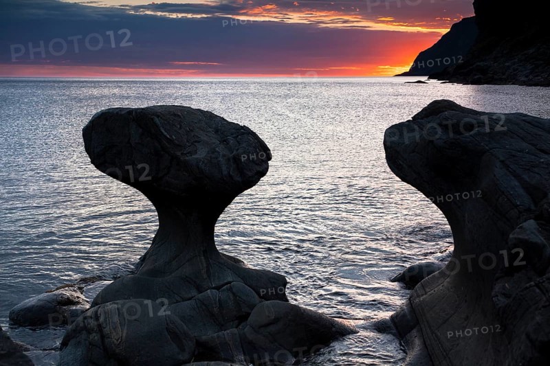 Kannestein or Kanne Stone with coastline at sunset