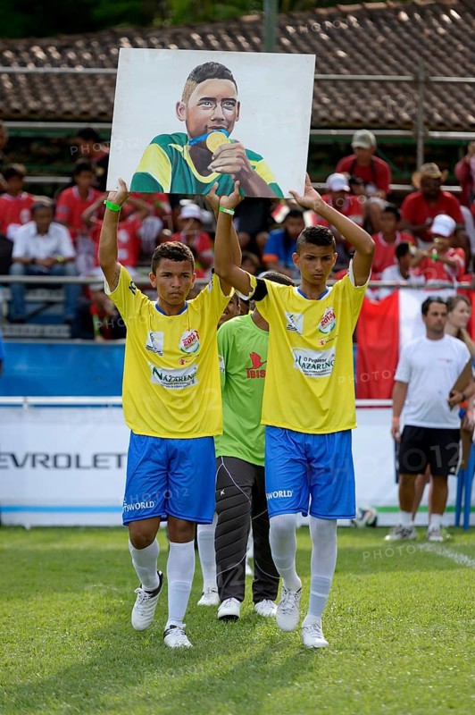 Entrance of the Brazilian team with an image of a recently murdered teammate
