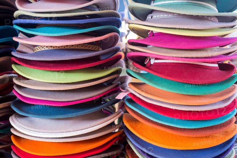 Stacks of colourful felt hats