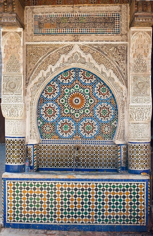 Traditional water fountain with mosaics and stucco work