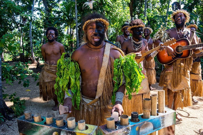 Group of traditional dressed men playing music