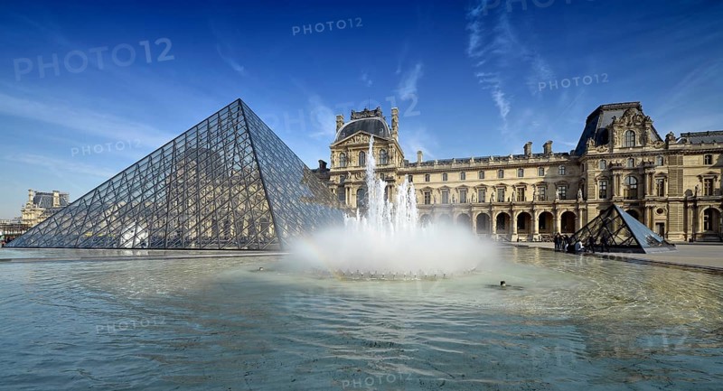 Fountains in front of the entrance pyramid of the Louvre Museum designed by architect IM Pei
