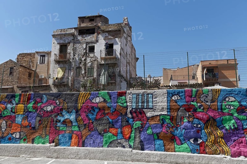 Colorful mural and dilapidated houses in the historic quarter of Borg Vecchio