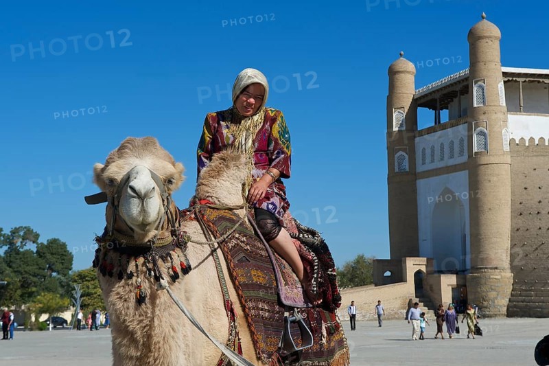Local tourist on a camel in front of the Ark fortress