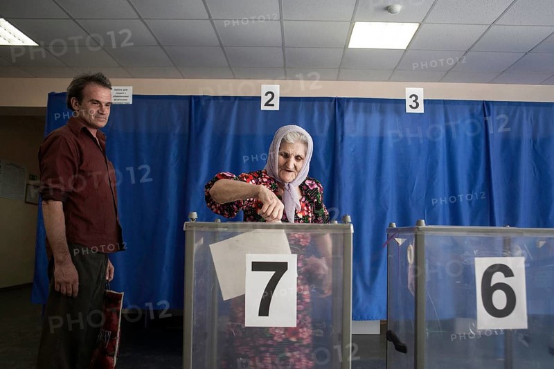 Elderly woman at the ballot box