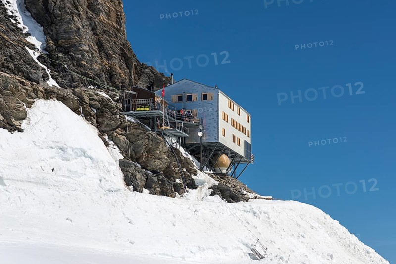 Monchsjoch Hut on a rock wall