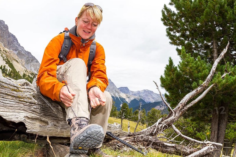 Woman lacing her hiking boots