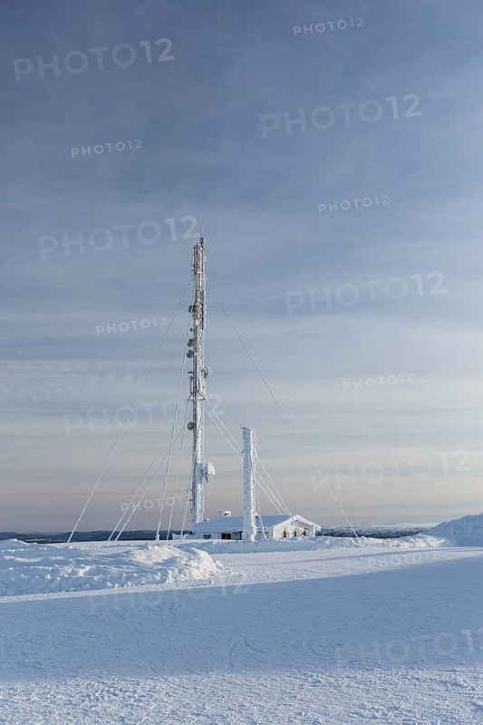 Snow-covered radio tower